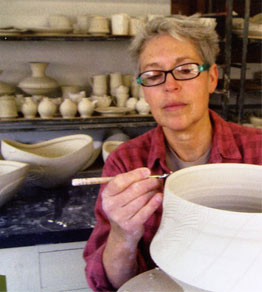 Silvie Granatelli working on a pot in her studio.