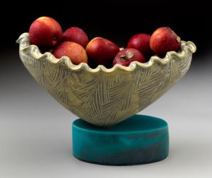 moon bowl with scalloped edges and turquoise base