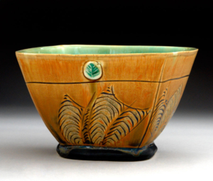 square serving bowl with leaf motif and turquoise glaze on interior